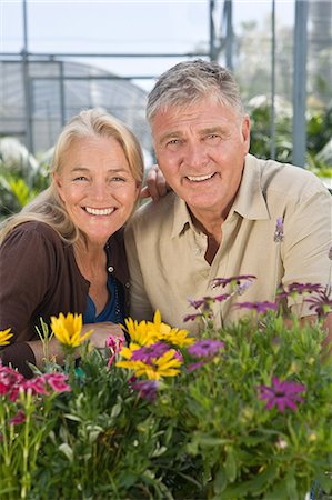 simsearch:6122-07697023,k - Mature couple with flowers in garden centre Stock Photo - Premium Royalty-Free, Code: 6122-07697056