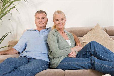 simsearch:6122-07697023,k - Mature couple sitting on sofa Stock Photo - Premium Royalty-Free, Code: 6122-07697028