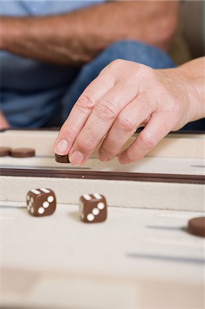 People playing backgammon Stock Photo - Premium Royalty-Free, Code: 6122-07697035