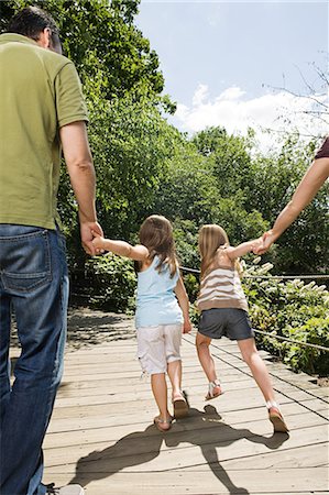 family walk anxious - Family with two girls, holding hands Stock Photo - Premium Royalty-Free, Code: 6122-07697359