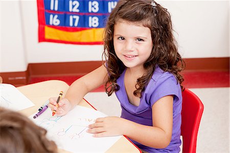 daycare - Girl drawing a picture in class Stock Photo - Premium Royalty-Free, Code: 6122-07697461