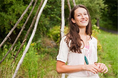 Teenage girl relaxing in the countryside Stock Photo - Premium Royalty-Free, Code: 6122-07697531
