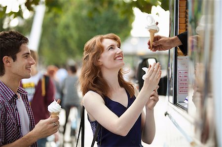 simsearch:6122-07697627,k - Young couple buying icecreams from a van Stock Photo - Premium Royalty-Free, Code: 6122-07697627