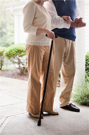 simsearch:649-07436819,k - Senior couple standing with walking stick Foto de stock - Royalty Free Premium, Número: 6122-07697638