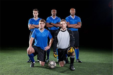 simsearch:6122-07697777,k - Soccer team on pitch at night Photographie de stock - Premium Libres de Droits, Code: 6122-07697779