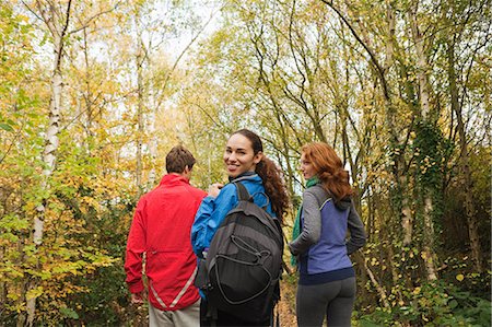 simsearch:6122-07697627,k - Young friends walking into forest Stock Photo - Premium Royalty-Free, Code: 6122-07697739