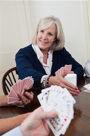 playing cards - Mature woman playing cards Stock Photo - Premium Royalty-Free, Code: 6122-07697873