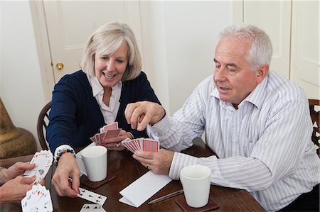 simsearch:6122-07697873,k - Mature woman and senior man playing cards Stock Photo - Premium Royalty-Free, Code: 6122-07697874