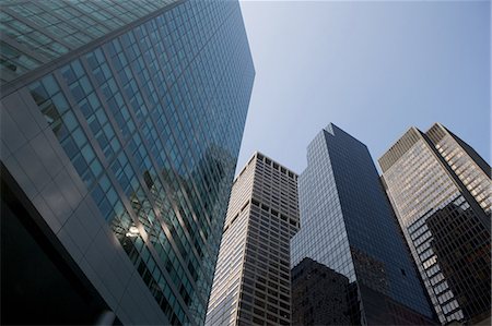 simsearch:6122-07697923,k - Low angle view skyscrapers, New York City, USA Stock Photo - Premium Royalty-Free, Code: 6122-07697927