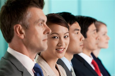 simsearch:614-06116477,k - Multi racial businesspeople in a line, portrait Stock Photo - Premium Royalty-Free, Code: 6122-07698536