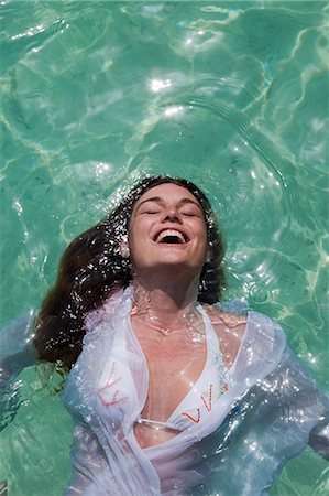 Woman swimming in tropical sea Stock Photo - Premium Royalty-Free, Code: 6122-07699107