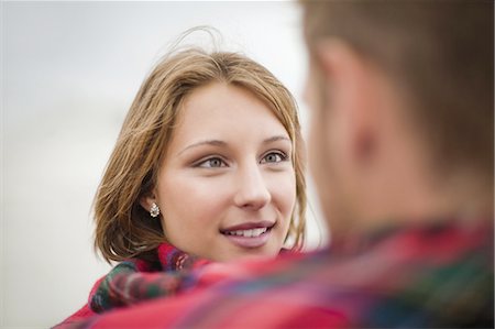 Couple wrapped in blanket together Stock Photo - Premium Royalty-Free, Code: 6122-07699395