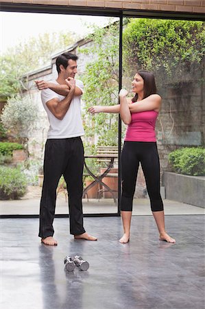 simsearch:633-06406424,k - Couple stretching before exercise Photographie de stock - Premium Libres de Droits, Code: 6122-07699511