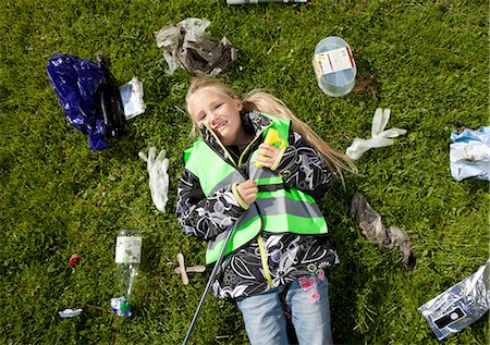 prong - Girl laying in garbage on lawn Stock Photo - Premium Royalty-Free, Code: 6122-07699894