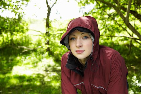 raincoat hood - Woman wearing parka in forest Stock Photo - Premium Royalty-Free, Code: 6122-07700146