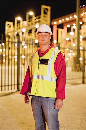 Worker wearing hardhat in shipyard Stock Photo - Premium Royalty-Free, Code: 6122-07700260