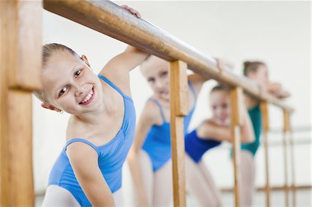 Ballet dancers standing at barre Stock Photo - Premium Royalty-Free, Code: 6122-07700330