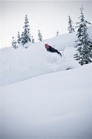 simsearch:649-03858383,k - Snowboarder riding down mountainside Stock Photo - Premium Royalty-Free, Code: 6122-07700538