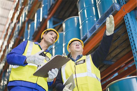 simsearch:6122-07700920,k - Workers talking in warehouse Stock Photo - Premium Royalty-Free, Code: 6122-07700900