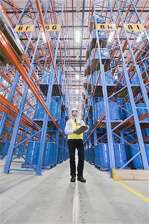 simsearch:6122-07700920,k - Worker standing in warehouse Stock Photo - Premium Royalty-Free, Code: 6122-07700914