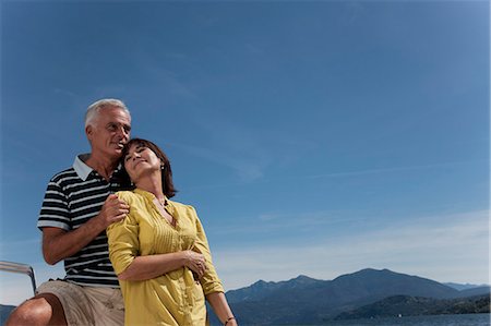 simsearch:649-02290354,k - Older couple relaxing outdoors Fotografie stock - Premium Royalty-Free, Codice: 6122-07701385