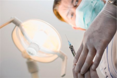 dentist (male) - Doctor preparing shot for patient Stock Photo - Premium Royalty-Free, Code: 6122-07701425