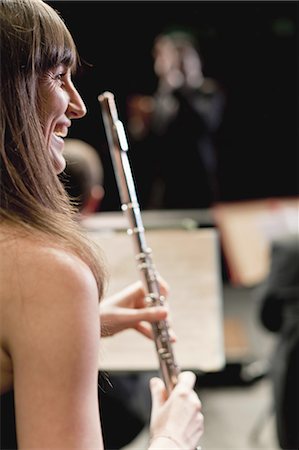 simsearch:649-05555714,k - Flute player in orchestra Photographie de stock - Premium Libres de Droits, Code: 6122-07702082