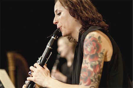 female musician - Clarinet player in orchestra Stock Photo - Premium Royalty-Free, Code: 6122-07702086