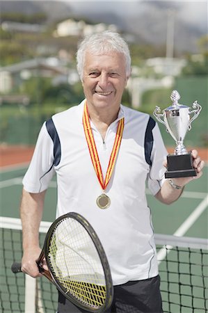 simsearch:693-06016661,k - Older man with trophy on tennis court Stock Photo - Premium Royalty-Free, Code: 6122-07702117