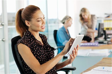 ereaders desk - Businesswoman using digital tablet Stock Photo - Premium Royalty-Free, Code: 6122-07702388