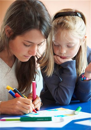 Close up of children drawing indoors Stock Photo - Premium Royalty-Free, Code: 6122-07703044