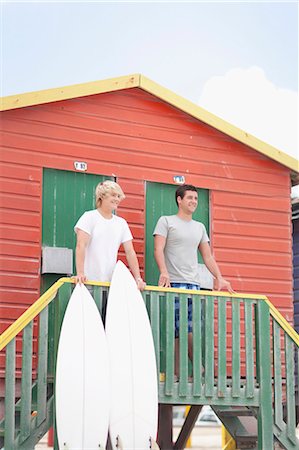 Teenage boys with surfboards on beach Stock Photo - Premium Royalty-Free, Code: 6122-07703167