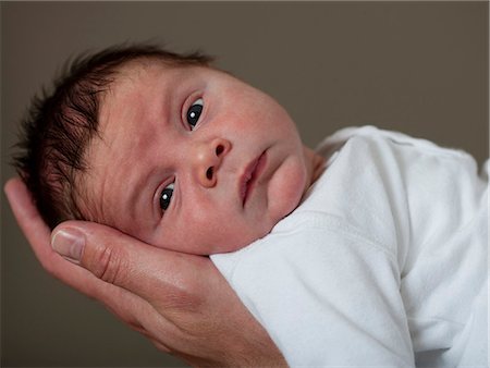 Close up of infant's face Foto de stock - Sin royalties Premium, Código: 6122-07703281