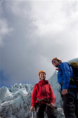 simsearch:6113-08655497,k - Hikers admiring glacial landscape Stock Photo - Premium Royalty-Free, Code: 6122-07703235
