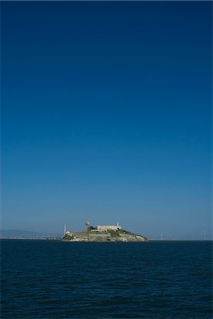 san francisco distance - Alcatraz Island in San Francisco Bay Stock Photo - Premium Royalty-Free, Code: 6122-07703359