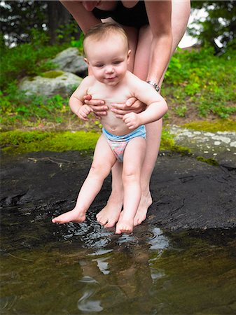simsearch:6122-07693618,k - Mother playing with toddler in creek Stock Photo - Premium Royalty-Free, Code: 6122-07703332