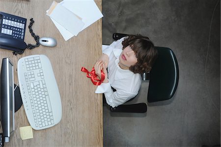 desk directly above - Overhead view of businesswoman at desk Stock Photo - Premium Royalty-Free, Code: 6122-07703665