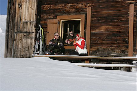 skiing chalet - Friends having coffee at ski chalet Stock Photo - Premium Royalty-Free, Code: 6122-07703725