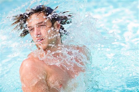 simsearch:649-05949971,k - Man splashing in pool Stock Photo - Premium Royalty-Free, Code: 6122-07704017