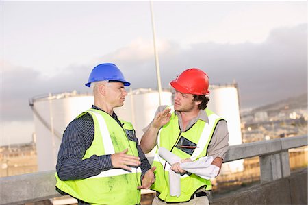 expand - Construction workers talking on site Stock Photo - Premium Royalty-Free, Code: 6122-07704024