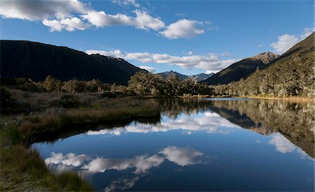 simsearch:6113-07243434,k - Sky reflected in lake in urban landscape Stock Photo - Premium Royalty-Free, Code: 6122-07704202