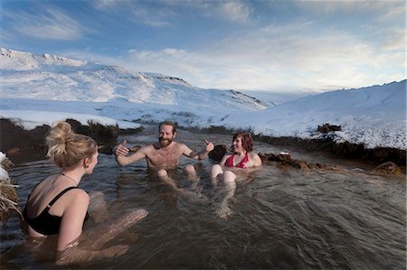 pictures of people in snow in bathing suit - Friends relaxing in glacial hot spring Stock Photo - Premium Royalty-Free, Code: 6122-07704223