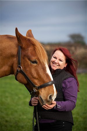 simsearch:614-08870625,k - Woman walking horse in rural field Stock Photo - Premium Royalty-Free, Code: 6122-07704333