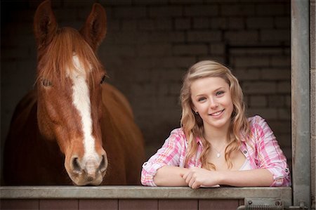 simsearch:6122-07704333,k - Teenage girl with horse in stables Stock Photo - Premium Royalty-Free, Code: 6122-07704331