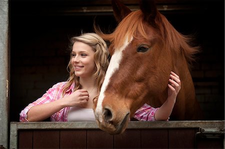 simsearch:6122-07704333,k - Teenage girl with horse in stables Stock Photo - Premium Royalty-Free, Code: 6122-07704332