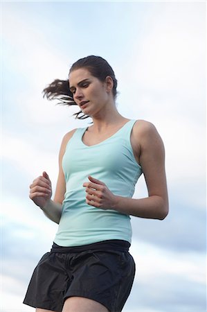 simsearch:6122-07703835,k - Woman running outdoors Stock Photo - Premium Royalty-Free, Code: 6122-07704540