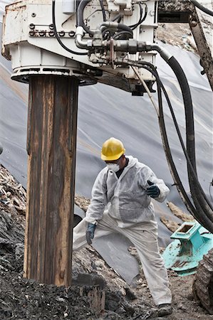 electric drill industry - Worker at garbage collection center Stock Photo - Premium Royalty-Free, Code: 6122-07704740