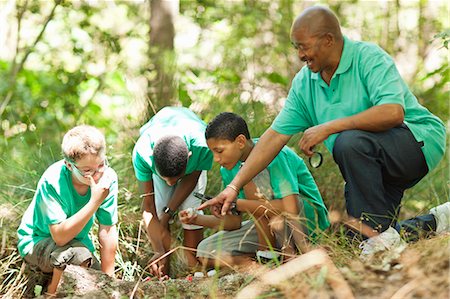 direction (leadership) - Students examining plants with teacher Stock Photo - Premium Royalty-Free, Code: 6122-07704894