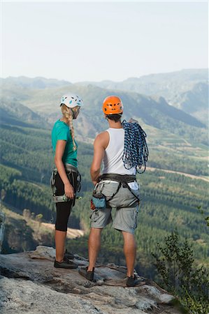 simsearch:6122-07692067,k - Climbers overlooking rural valley Stock Photo - Premium Royalty-Free, Code: 6122-07704999