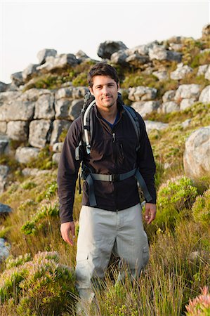 simsearch:6122-07692197,k - Hiker standing in rocky field Foto de stock - Sin royalties Premium, Código: 6122-07705015